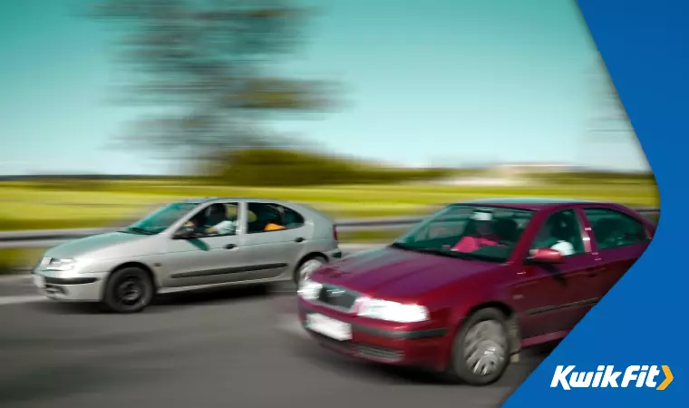 A car overtakes another at a dangerous speed.