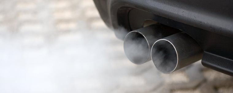 Car exhaust emitting white smoke.