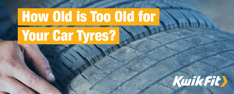 Technician running finger through tread pattern of a tyre.