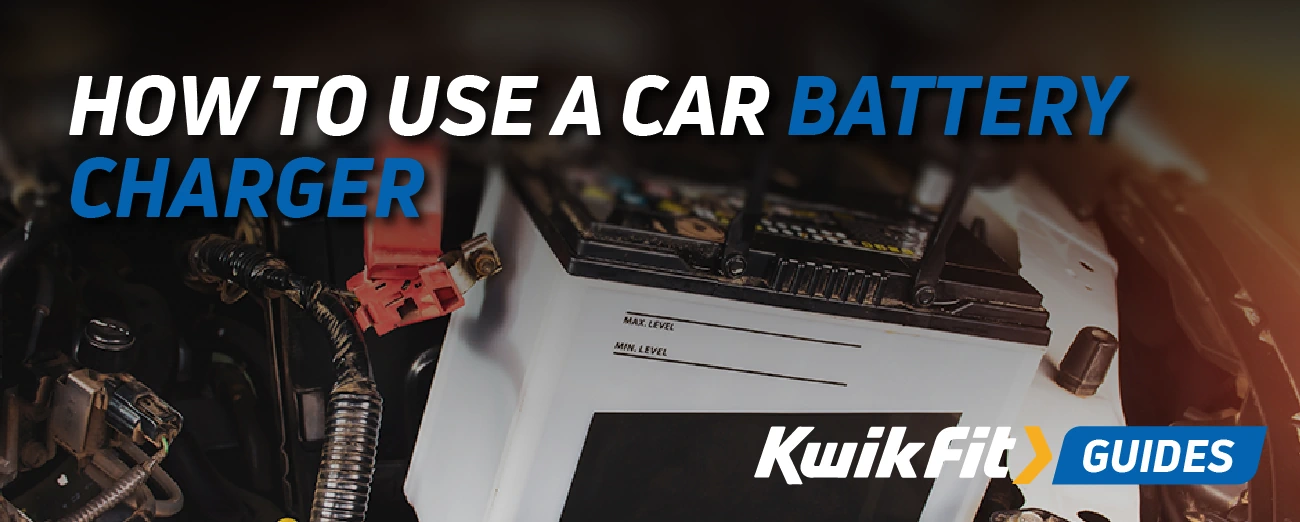 Car battery under the bonnet of a car.