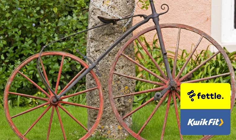 An old 'Boneshaker' bicycle made of wood and iron.