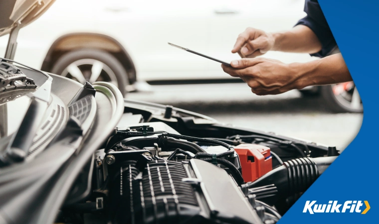 Mechanic doing a check on new car engine.