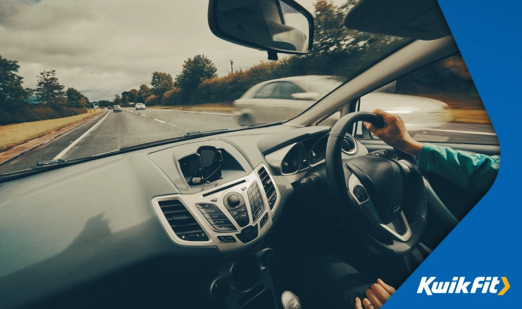 A UK driver on a typical tree-lined A-road.